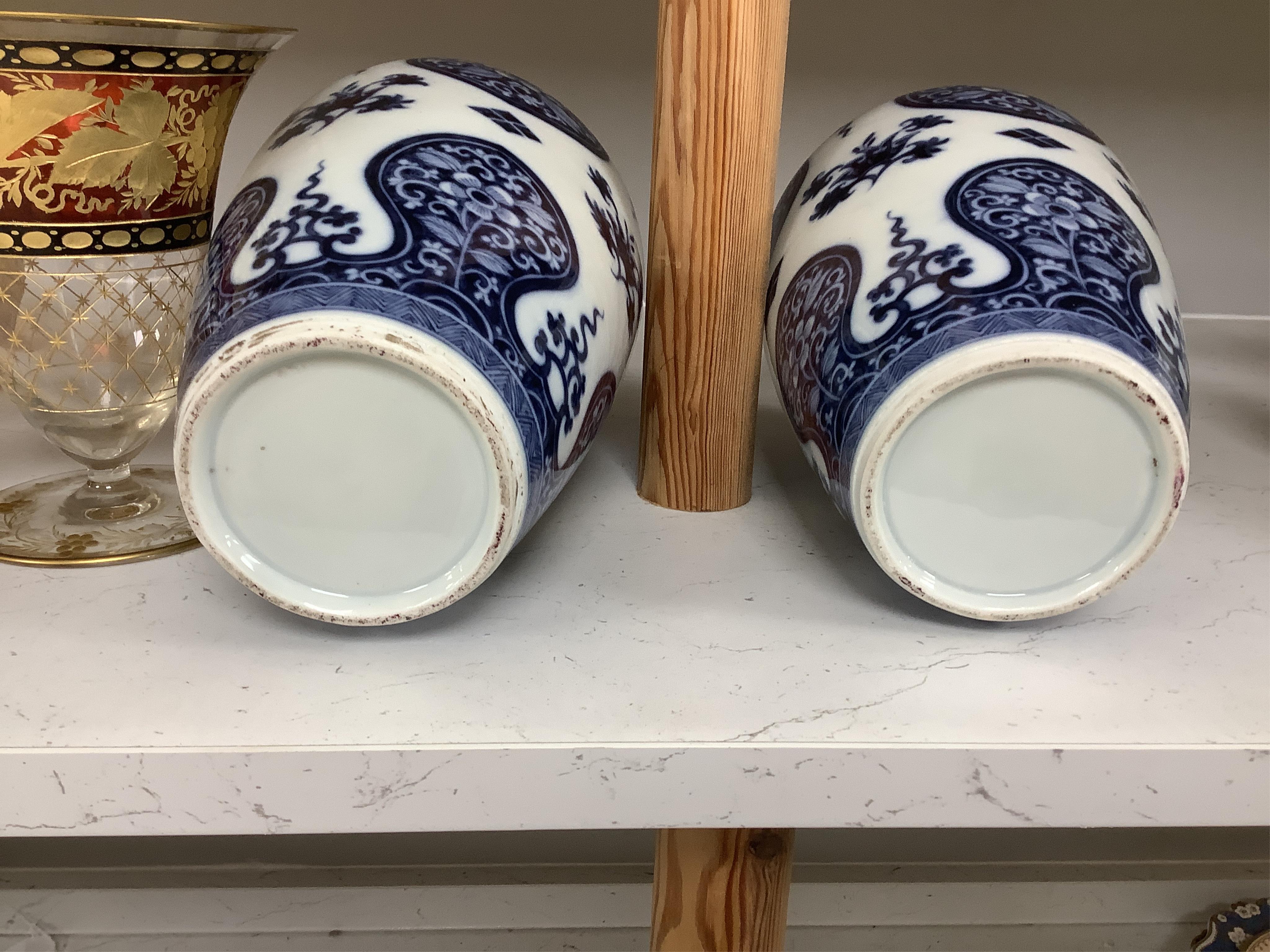 A pair of Samson of Paris blue and white vases, in Kangxi style 23cm high. Condition - good